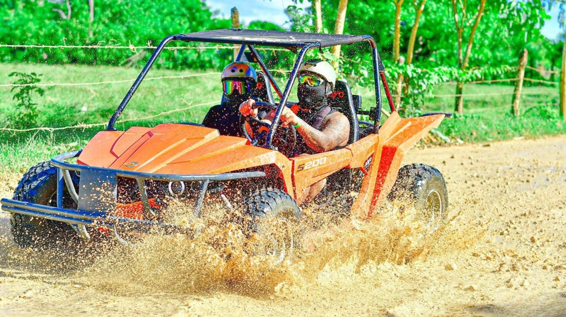 ATV buggy splashing through mud near Punta Cana
